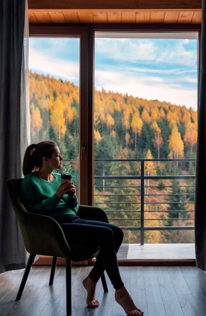 A traveler relaxing on a hotel bed while acclimatizing to the mountain altitude.