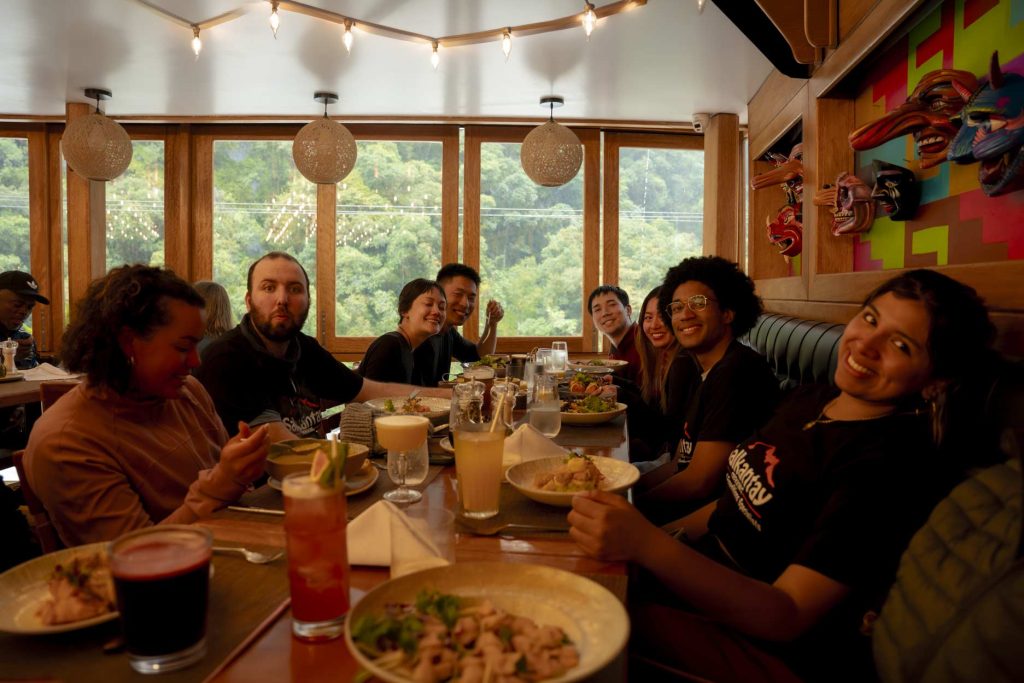 Group of tourists eating at a restaurant in the town of Aguas Calientes