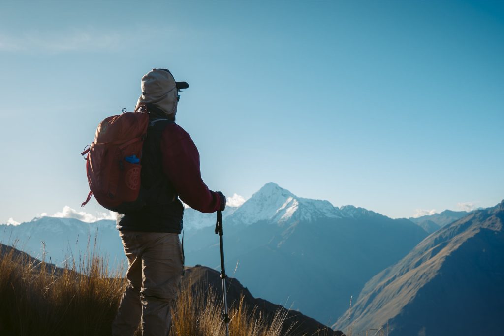 Tourist admiring the Peruvian Andes on the Ancascocha route.