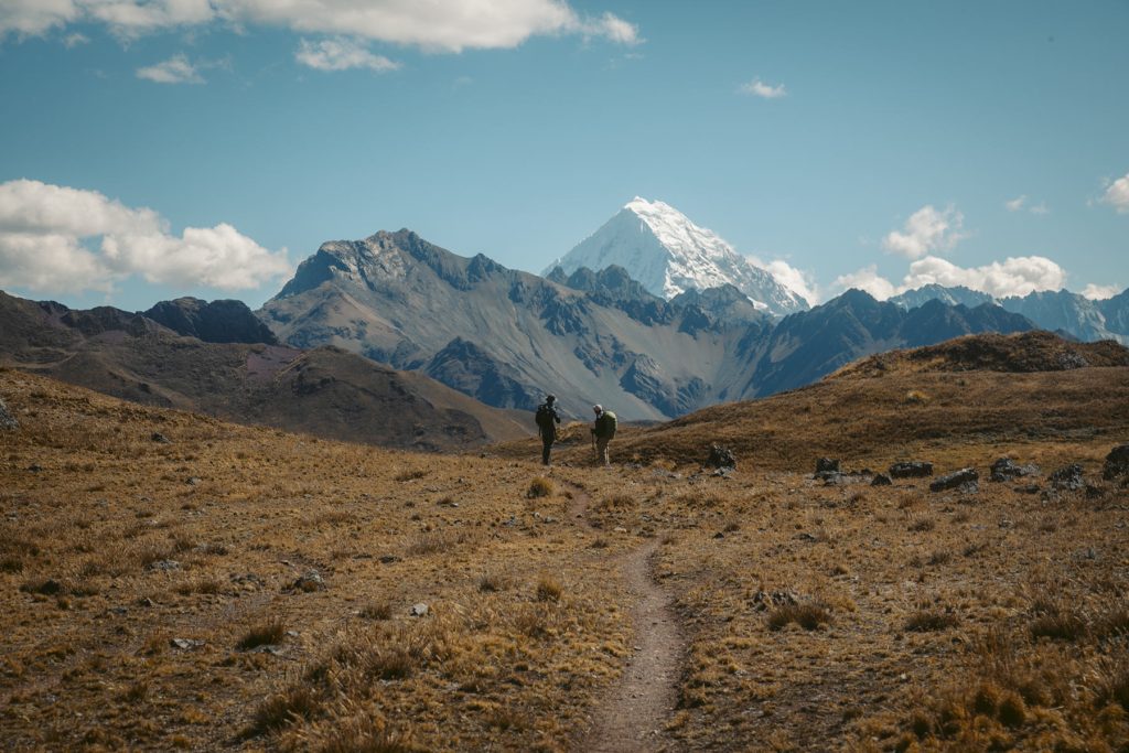 Tourists admiring the mountainous Andes on the Ancascocha route.