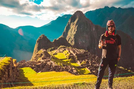 Tourist posing for an unforgettable photo in Machu Picchu