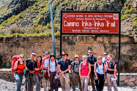 A group of tourists at kilometer 82 about to start the famous Inca trail