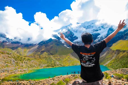 Tourist with a panoramic view of the mountain and Humantay lake