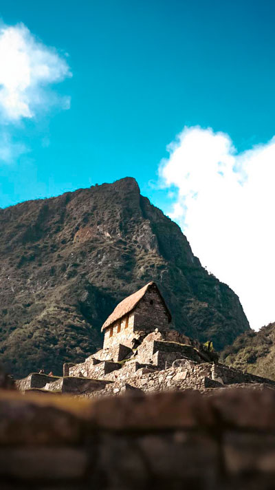 Woman hiking the incredible ancient Inca Trail to Machu Picchu near the cliff