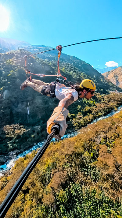 Man Ziplining in the Inca Jungle to Machu Picchu - Adventure activities in Cusco (Biking, Rafting, Ziplining)