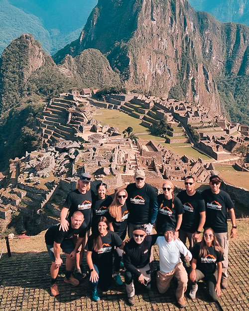 Carlos Chuchullo with travelers at Machu Picchu