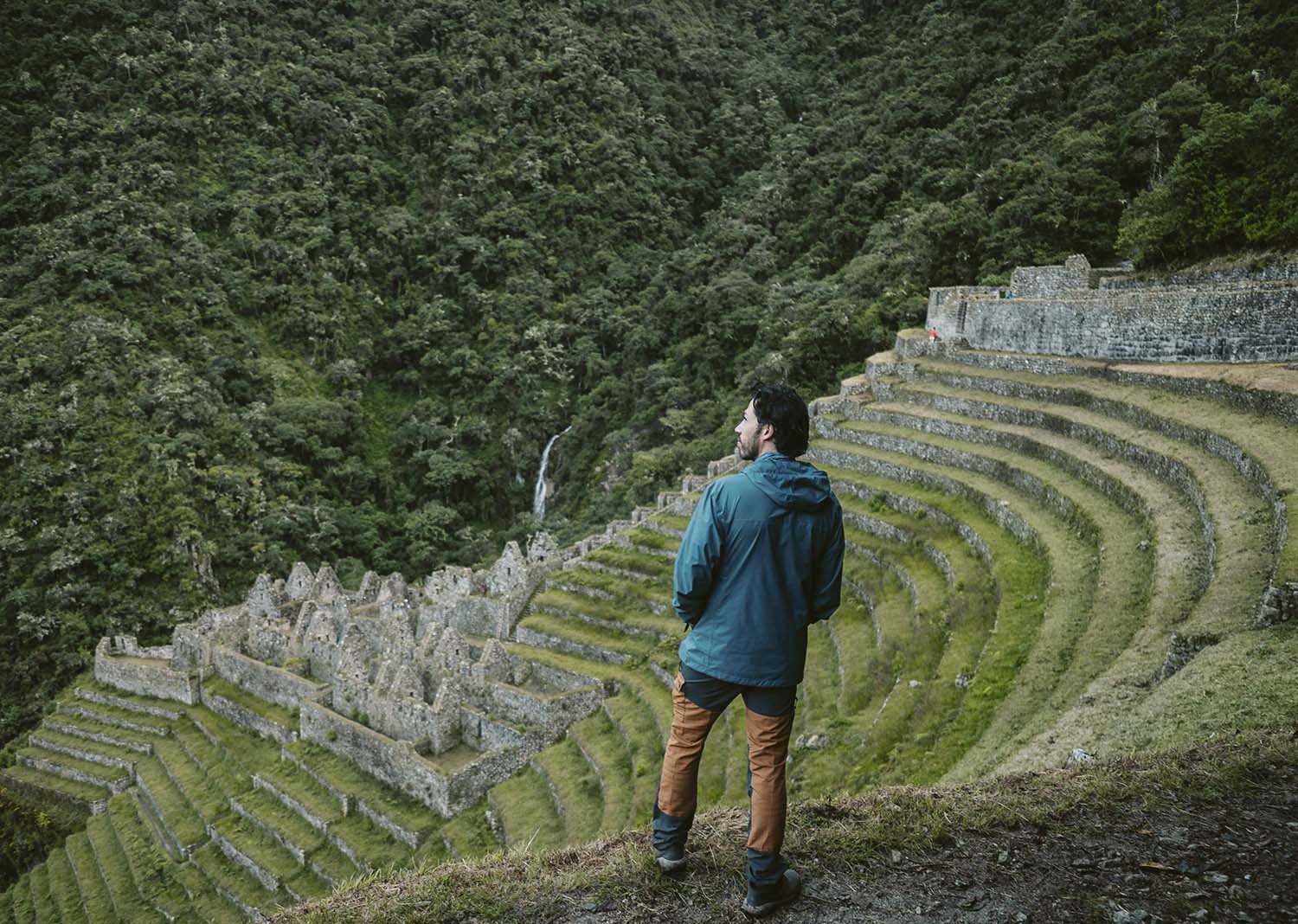 Hiker overlooking the Wiñay Wayna terraces on the Inca Trail