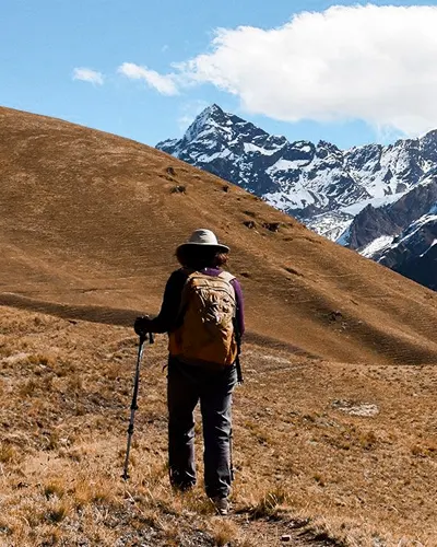 Tourist walking to the direction of the mountain and the Ancascocha lake