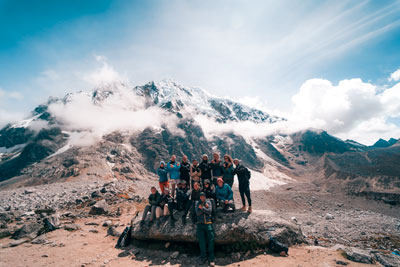 A group of tourists posing at the Salkantay pass