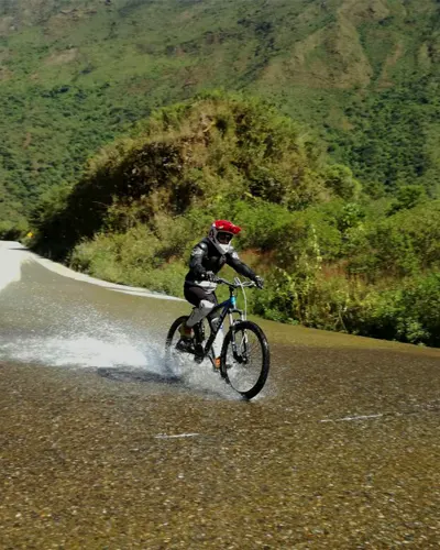 Tourist enjoying his bike adventure on the Inca Jungle route to Machu Picchu