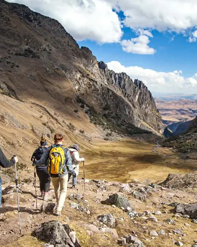 Tourists walking through the wonderful mountains of Lares