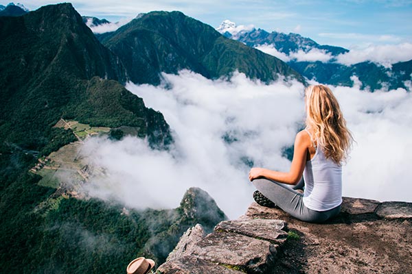 Woman with panoramic view of Machu Picchu