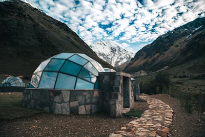 Sky camp in Soraypampa with background of the Salkantay Sacred Mountain during the starting of the night.