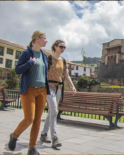 Two female tourists enjoying a walk through the streets of Cusco