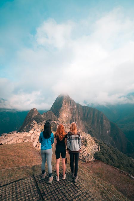Tourists looking at Machu Picchu