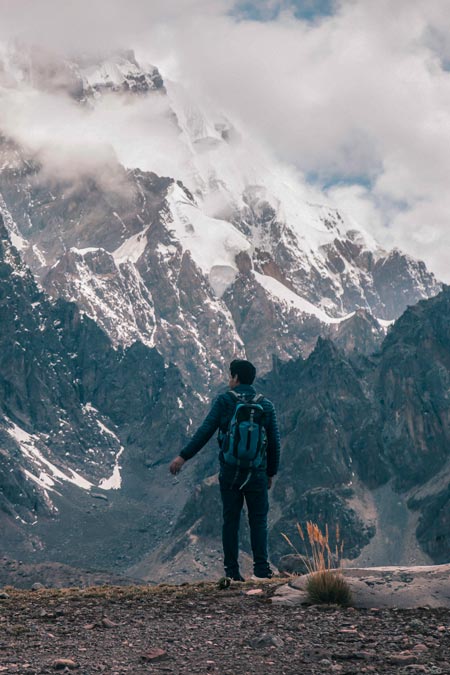 Tourist backpacking trekking to see the great Ausangate mountain.