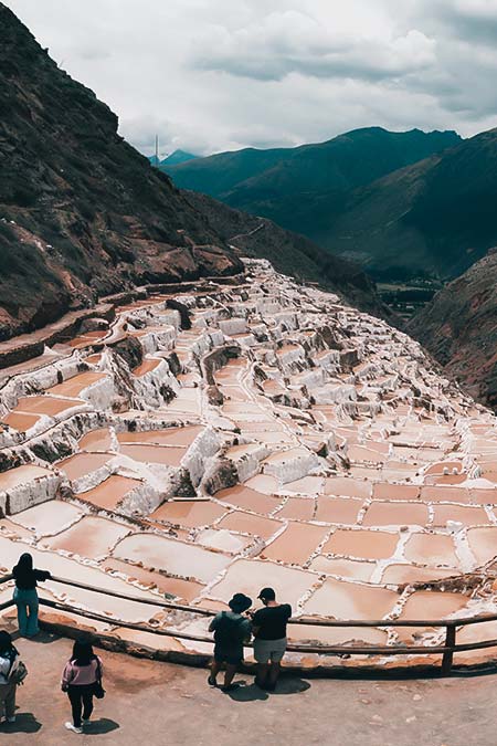 Tourists appreciating the salt mines of Maras