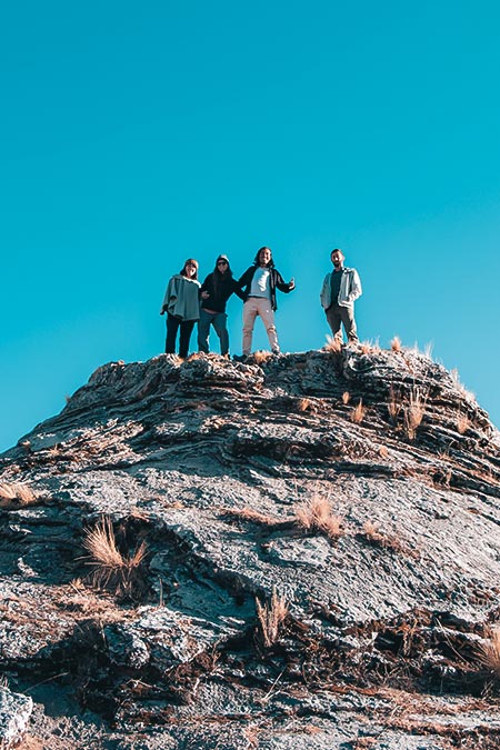 Tourists and guide on small volcano