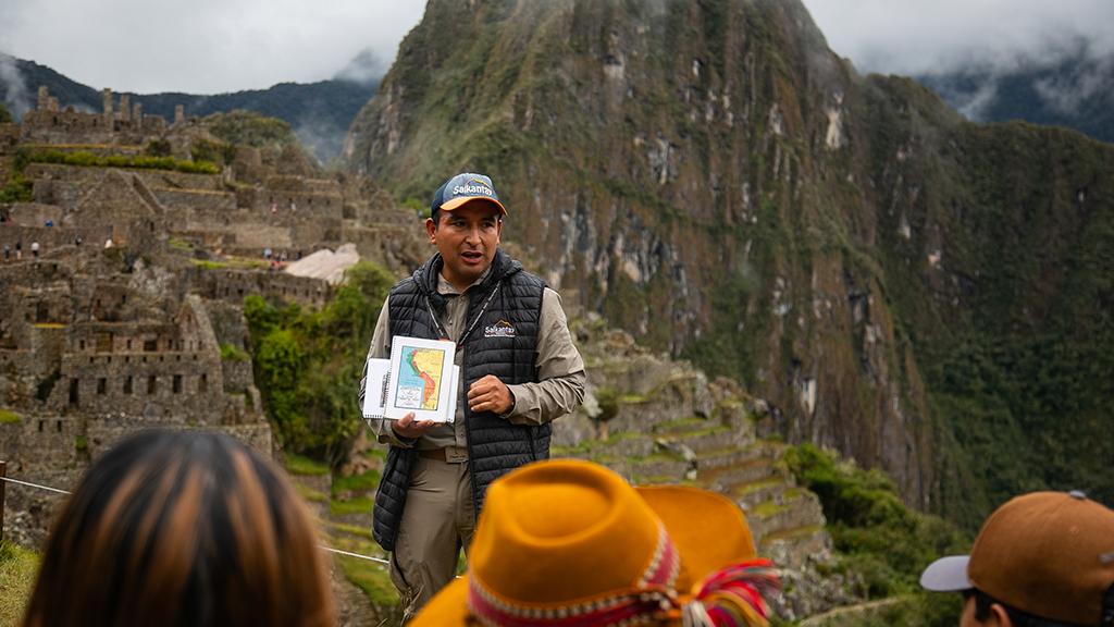 Salkantay Trekking tour guide giving a briefing at Machu Picchu